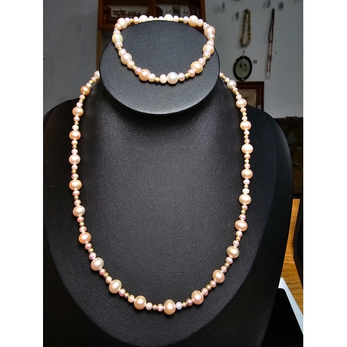 296 - Good quality matching Genuine Pearl necklace and expandable bracelet featuring 10k gold beads to the... 