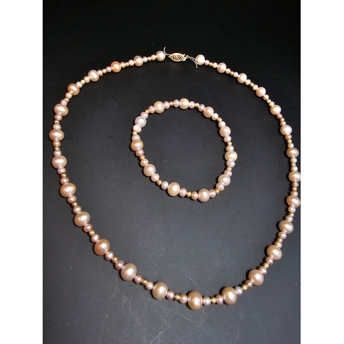 296 - Good quality matching Genuine Pearl necklace and expandable bracelet featuring 10k gold beads to the... 