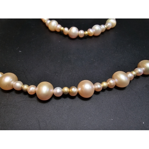 296 - Good quality matching Genuine Pearl necklace and expandable bracelet featuring 10k gold beads to the... 