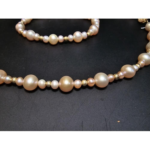 296 - Good quality matching Genuine Pearl necklace and expandable bracelet featuring 10k gold beads to the... 