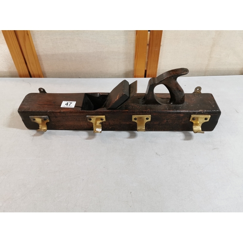 47 - Vintage planer formed into a coat hanger with brass coat hooks in good overall condition