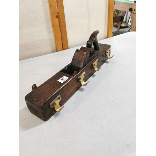 47 - Vintage planer formed into a coat hanger with brass coat hooks in good overall condition