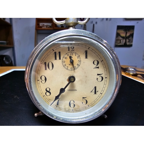 285 - An attractive vintage chrome 8 day mechanical wind up travel alarm clock by Veglia in good condition... 