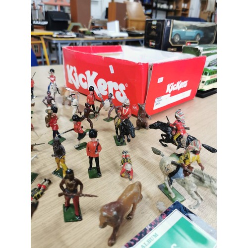 39 - A large quantity of good quality early vintage Britains lead solider and animal figures along with a... 