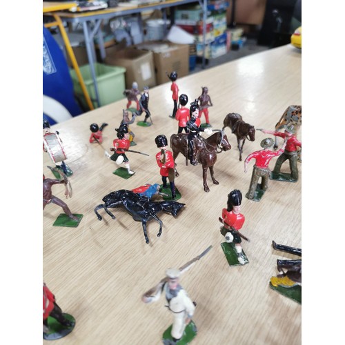 39 - A large quantity of good quality early vintage Britains lead solider and animal figures along with a... 