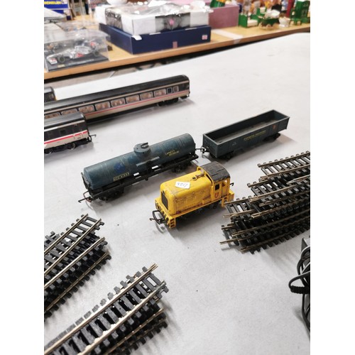 42 - A collection of 00 gauge coaches along with 1 loco and a quantity of 00 gauge track.