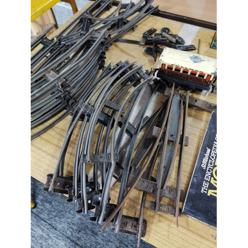 43 - A quantity of 0 gauge model railway items to include loco, rolling stock, bridge, etc.