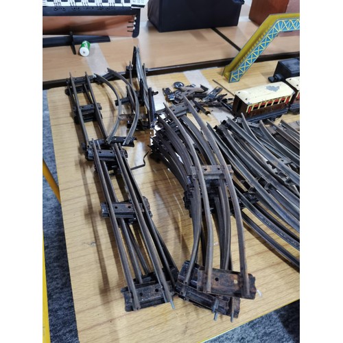 43 - A quantity of 0 gauge model railway items to include loco, rolling stock, bridge, etc.