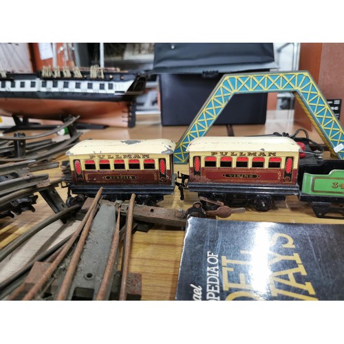 43 - A quantity of 0 gauge model railway items to include loco, rolling stock, bridge, etc.