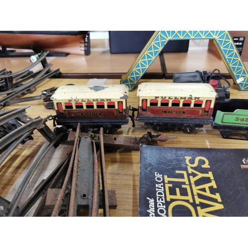 43 - A quantity of 0 gauge model railway items to include loco, rolling stock, bridge, etc.