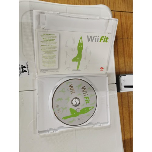 44 - A Nintendo Wii games console along with a Wii Fit board and game. All in very good condition, cables... 