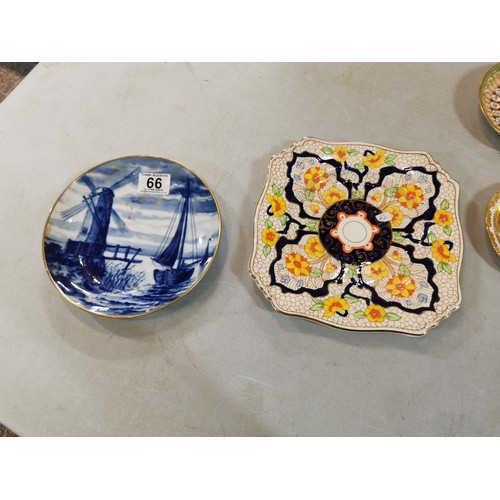 66 - Collection of ceramic plates and pin dishes inc a 18th century green and gilded hand painted saucer,... 