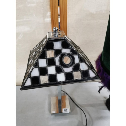 87 - Good quality Tiffany style table lamp with chrome base and black and white stained glass shade along... 