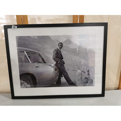 90 - A framed and glazed print of Sean Connery as James Bond 007 in the alps with an Aston Martin DB6, fr... 