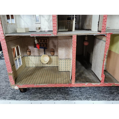 97 - Very large impressive dolls house perfect for restoration, in the design of a Victorian red brick ho... 