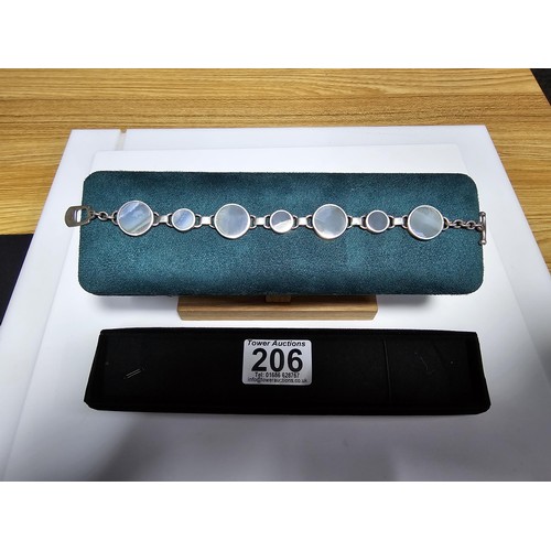 206 - A good quality 925 silver panel bracelet inset with 7 large round blue lace agate hardstones, presen... 