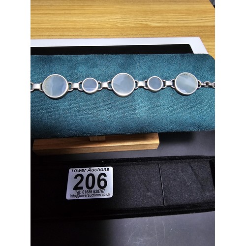 206 - A good quality 925 silver panel bracelet inset with 7 large round blue lace agate hardstones, presen... 