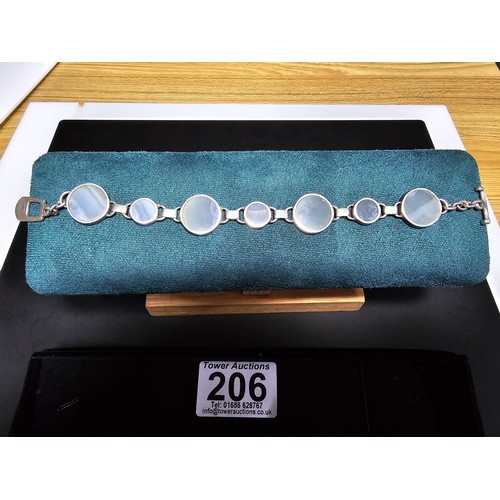 206 - A good quality 925 silver panel bracelet inset with 7 large round blue lace agate hardstones, presen... 