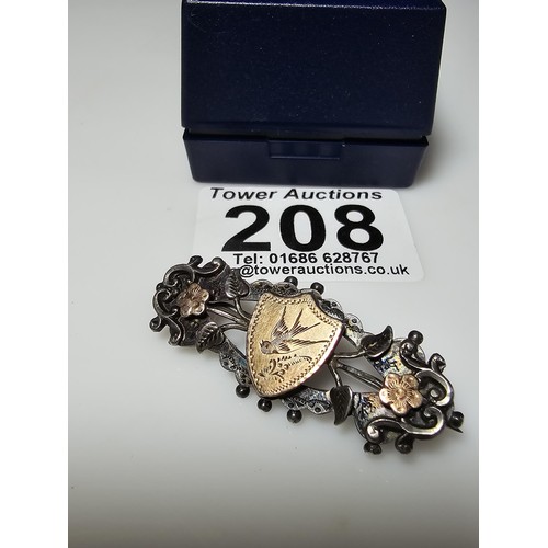 208 - A pretty antique hallmarked silver sweetheart brooch having  real gold fronts to the shield and flow... 