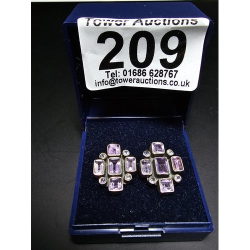 209 - A pair of good quality 925 silver stud earrings, both earrings are inset with faceted amethyst gemst... 