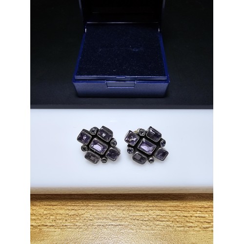 209 - A pair of good quality 925 silver stud earrings, both earrings are inset with faceted amethyst gemst... 