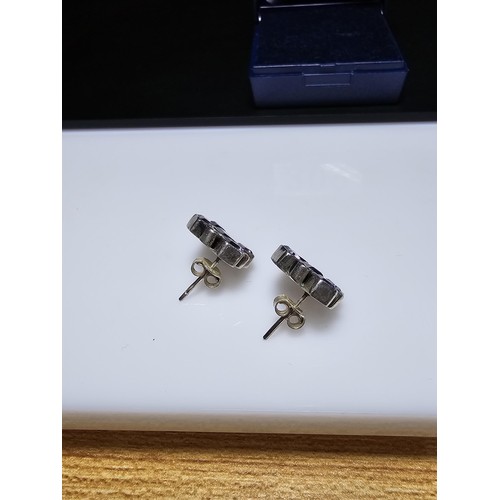 209 - A pair of good quality 925 silver stud earrings, both earrings are inset with faceted amethyst gemst... 