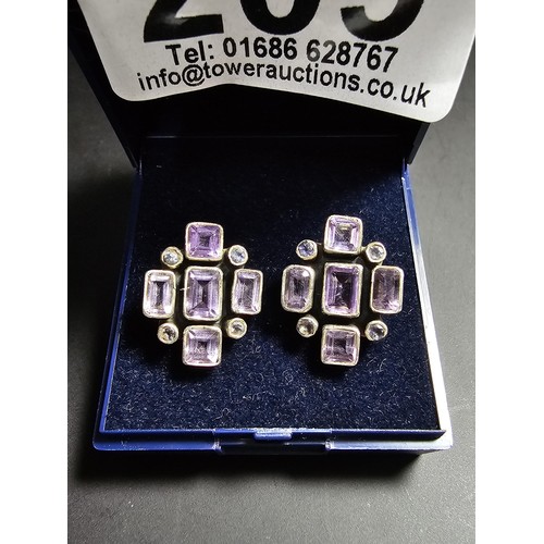 209 - A pair of good quality 925 silver stud earrings, both earrings are inset with faceted amethyst gemst... 