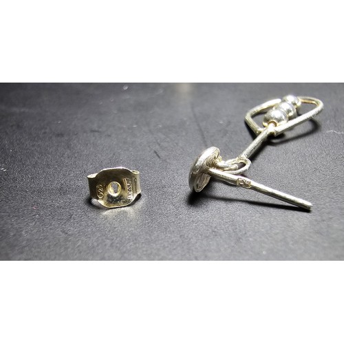 212 - A pair of unused 925 silver stud drop earrings featuring an unusual bead and hoop design, complete w... 