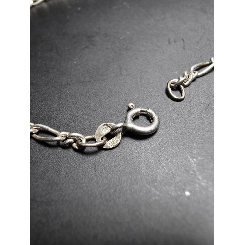 213 - A 925 silver bracelet with a Figaro link design, has a length of 9