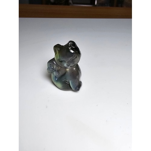 216 - A stunning labradorite carved cat figure presenting very good flashing colours throughout of yellows... 