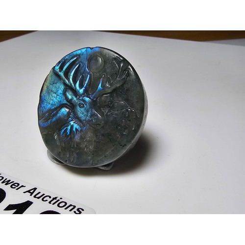 218 - A stunning carved labradorite hardstone carved disk with a stag scene presenting excellent natural f... 