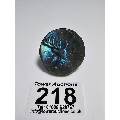 218 - A stunning carved labradorite hardstone carved disk with a stag scene presenting excellent natural f... 