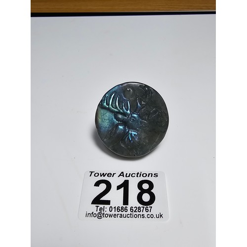 218 - A stunning carved labradorite hardstone carved disk with a stag scene presenting excellent natural f... 