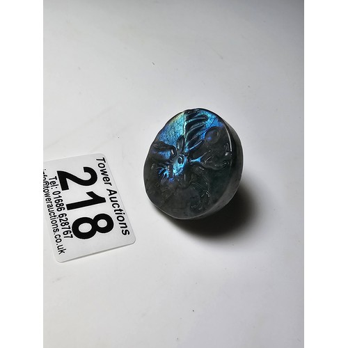 218 - A stunning carved labradorite hardstone carved disk with a stag scene presenting excellent natural f... 