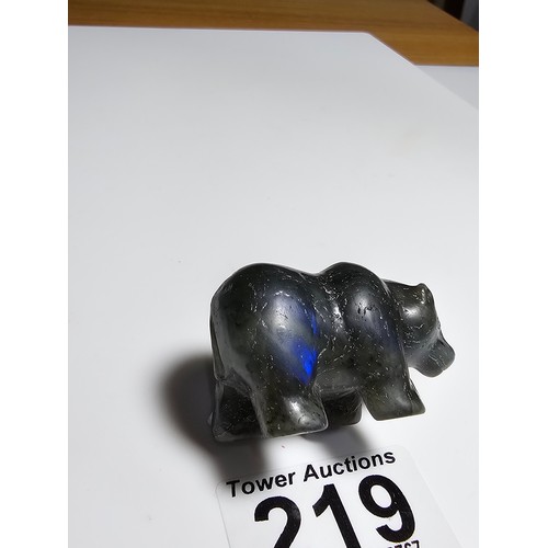 219 - A pretty labradorite hardstone carved polar bear figure presenting excellent natural deep blue flash... 