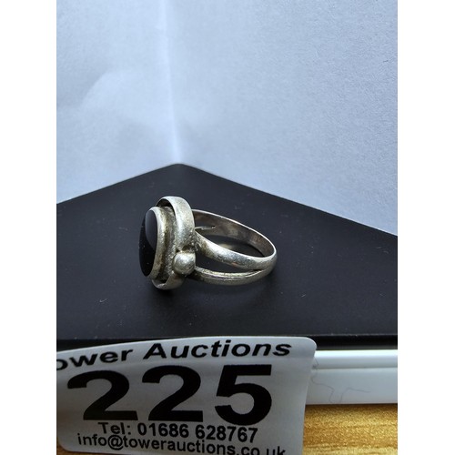 225 - A good vintage 925 silver ring with an unusual design inset with a large black onyx stone. Size K, i... 