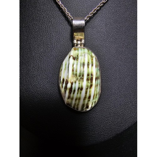 227 - A 925 silver large pendant inset with a colourful green natural glazed shell set on an 18