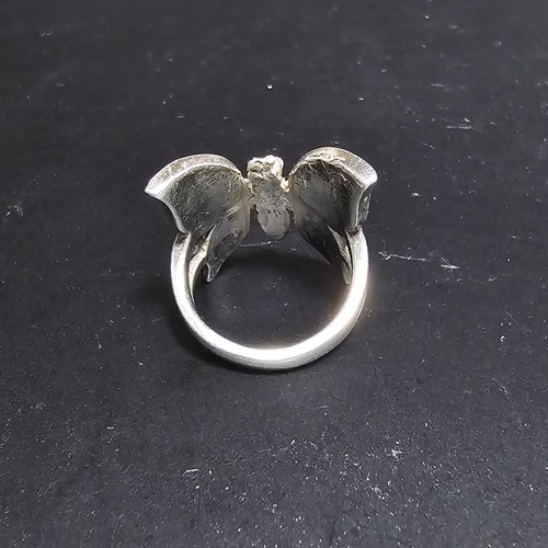 228 - A very pretty 925 sterling silver butterfly ring featuring a large butterfly design inset with mothe... 