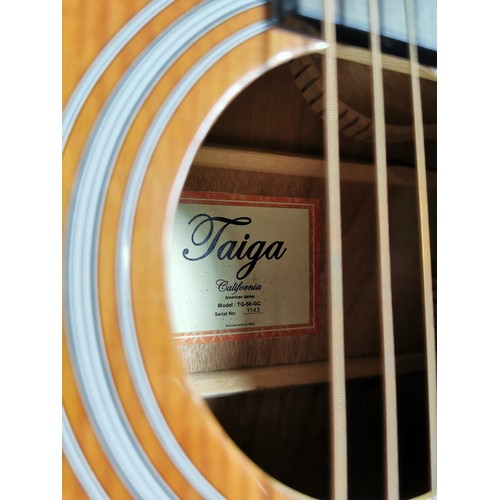 133 - A Taiga California series electro acoustic guitar, with gigbag in good order.