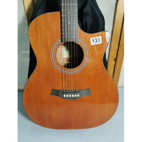 133 - A Taiga California series electro acoustic guitar, with gigbag in good order.