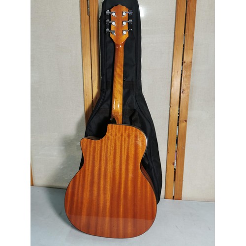 133 - A Taiga California series electro acoustic guitar, with gigbag in good order.