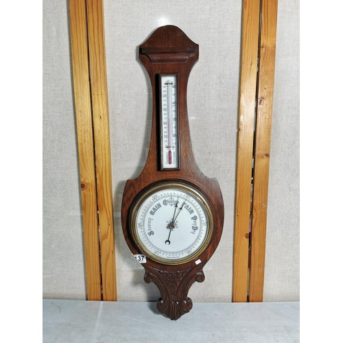 137 - A vintage wooden banjo barometer complete with temperature gauge, carving to the base, height 80cm h... 