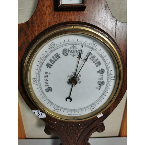 137 - A vintage wooden banjo barometer complete with temperature gauge, carving to the base, height 80cm h... 