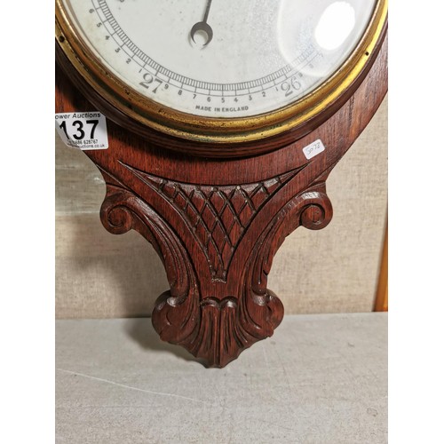 137 - A vintage wooden banjo barometer complete with temperature gauge, carving to the base, height 80cm h... 