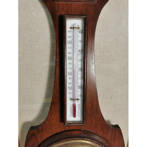 137 - A vintage wooden banjo barometer complete with temperature gauge, carving to the base, height 80cm h... 