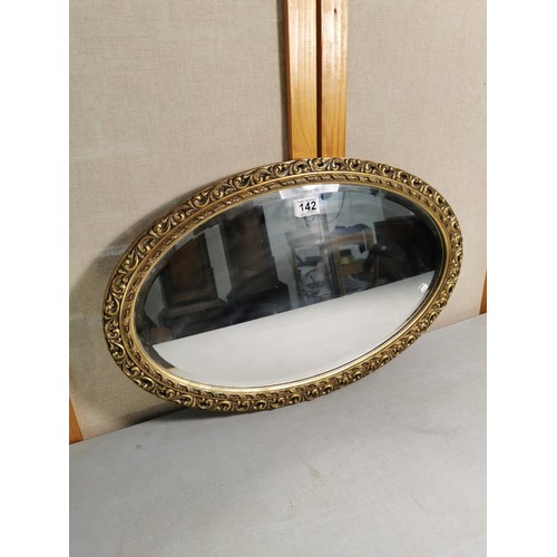 142 - An Adam Morris vintage wooden gilt framed bevel edged mirror in good order measures 39cm high 62cm w... 