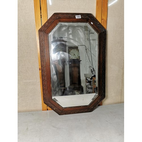 143 - Good quality large oak framed bevel edged mirror with carving to the edges, measures 82cm high 53cm ... 