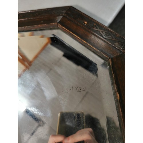 143 - Good quality large oak framed bevel edged mirror with carving to the edges, measures 82cm high 53cm ... 