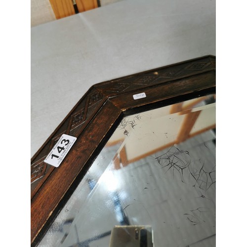 143 - Good quality large oak framed bevel edged mirror with carving to the edges, measures 82cm high 53cm ... 