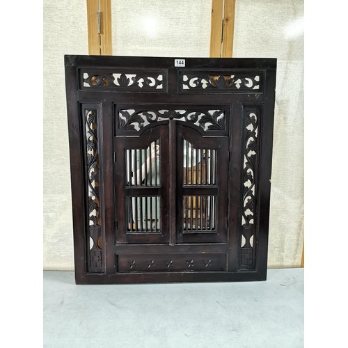 144 - Large impressive rosewood Indonesian shuttered mirror with carving to the edges, doors open to revea... 